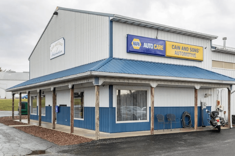 NAPA 3-year/36,000-mile warranty, auto repair in Glen Rock, PA by Cain and Sons’ Automotive. Exterior view of Cain and Sons’ Automotive, trusted NAPA AutoCare Center offering professional auto repair and maintenance services, showcasing the shop’s blue and white building with a welcoming entrance.
